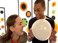 photo of hosts michael and mariko with balloon