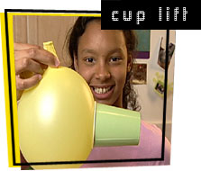 photo of balloon lifting cup