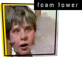 photo of boy watching foam tower