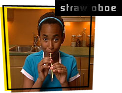photo of girl playing a straw oboe