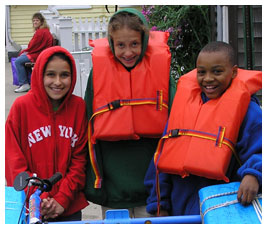 A bike, three kids, and some floaties.