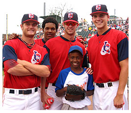 Mike posing with members of the minor league team, the Lowell Spinners.