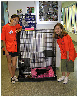 Bridget and Madi at a pet adoption shelter.