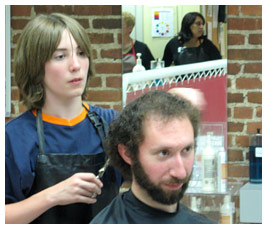 Jay in a salon cutting a man's hair.