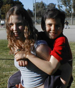 Brother piggyback on sister