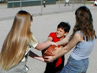 Girls bullying smaller boy