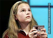 Morgan Pozgar types furiously on her keypad