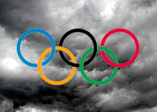 The Olypmic logo set against a stormy sky